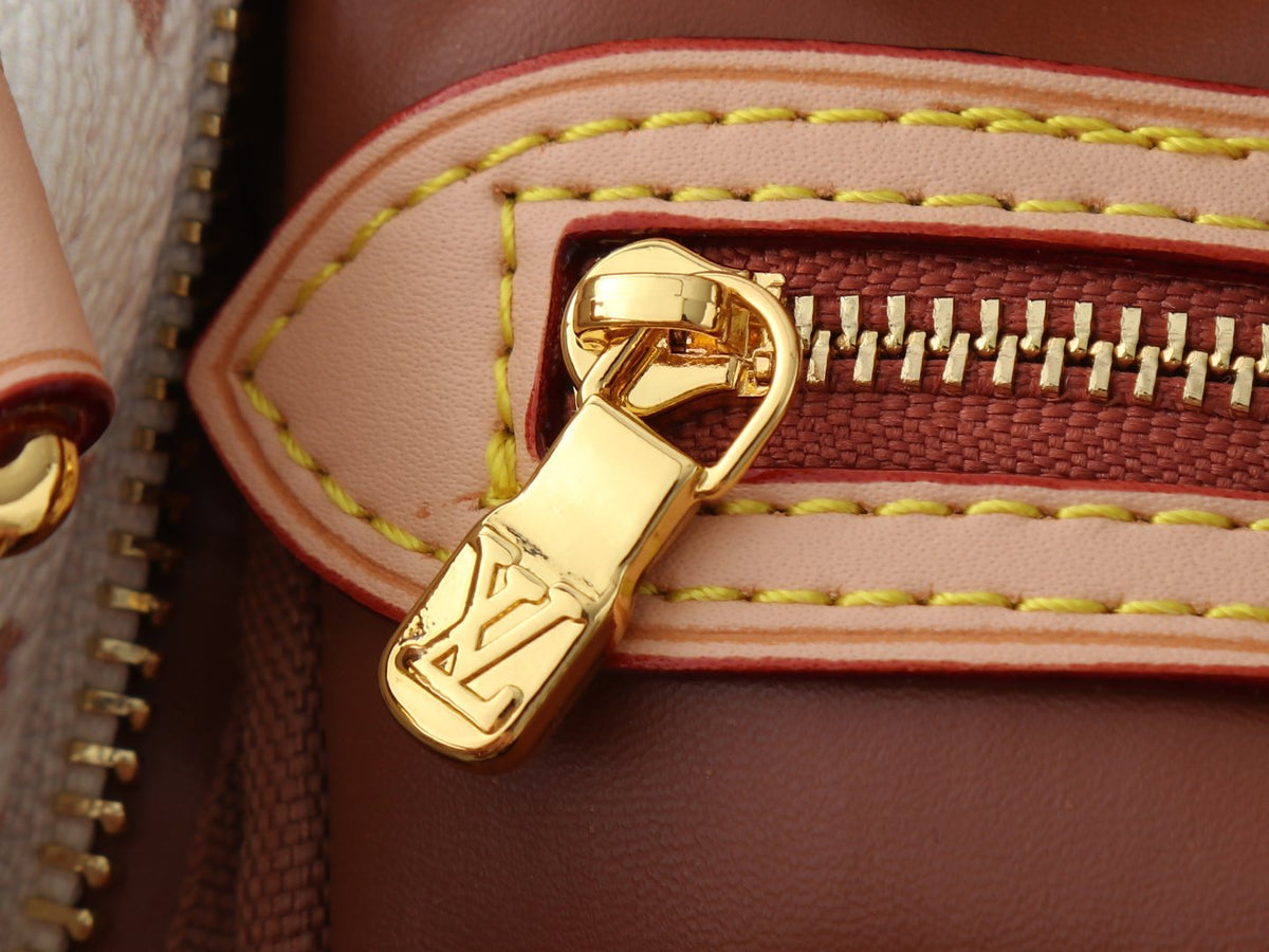 Louis Vuitton Crafty Speedy Bandoulière Handbag — detail