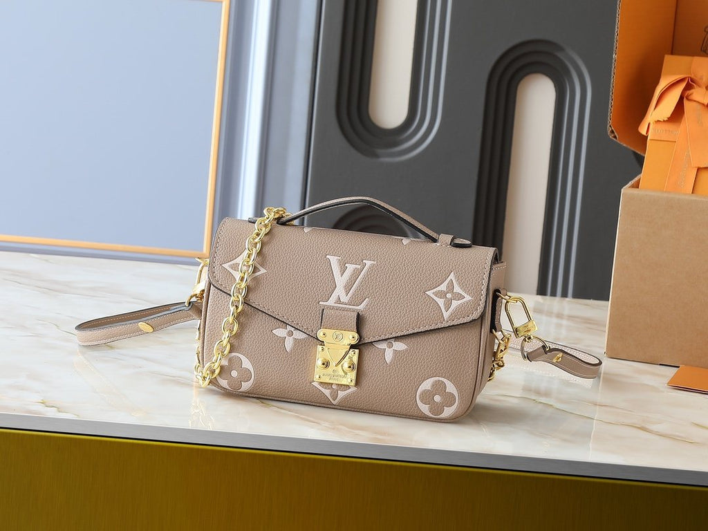 Louis Vuitton Pochette Métis East West Monogram Empreinte Bag — hero