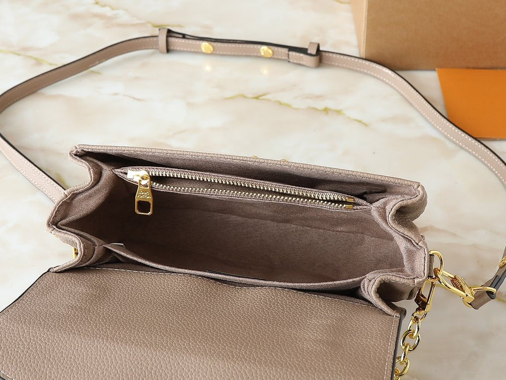 Louis Vuitton Pochette Métis East West Monogram Empreinte Bag — detail