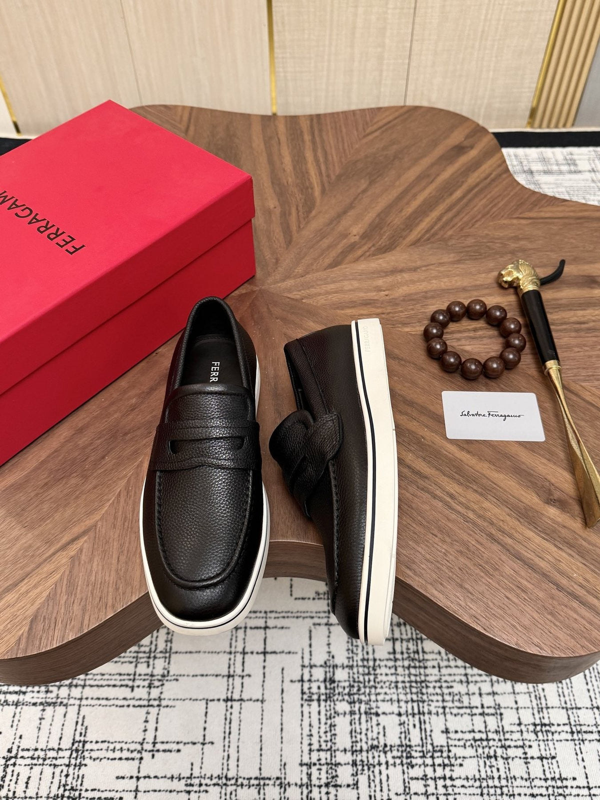 Salvatore Ferragamo Black Loafers with White Soles — front