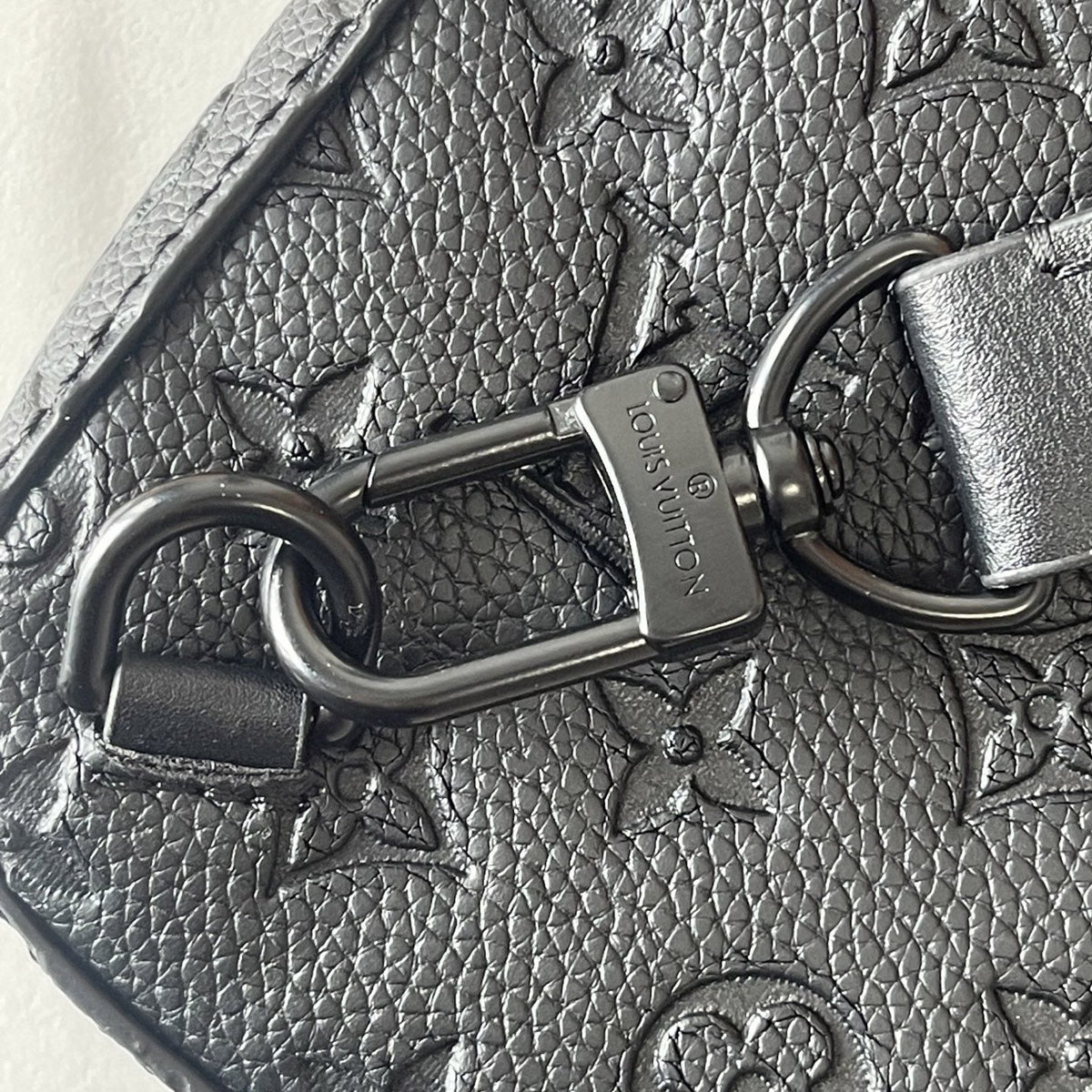 Louis Vuitton Avenue Sling Bag PM in Black Embossed Leather — detail