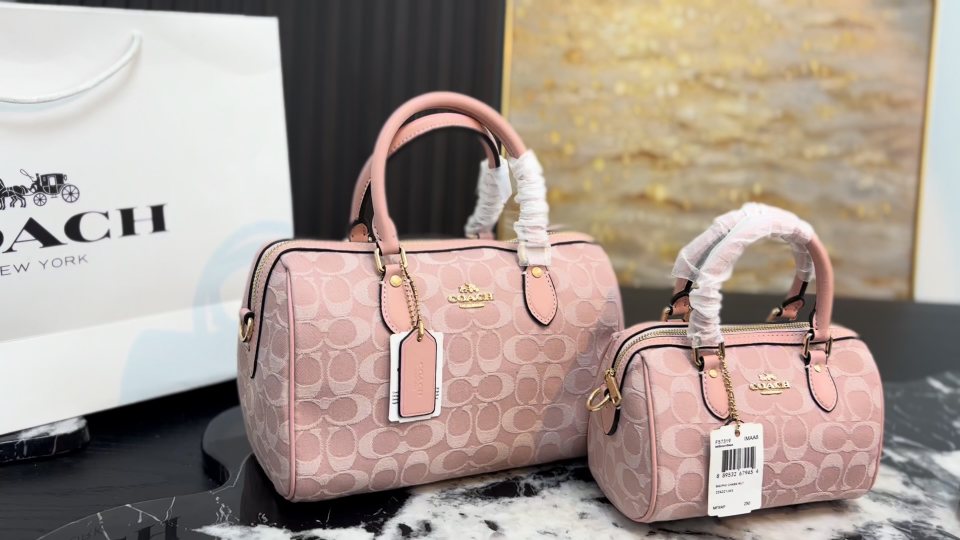 Coach Rowan Pink Signature Barrel Bag — comparison