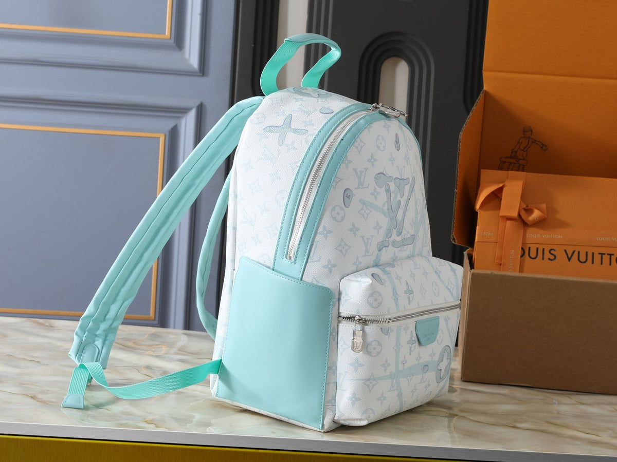 Louis Vuitton Discovery Monogram Backpack — side