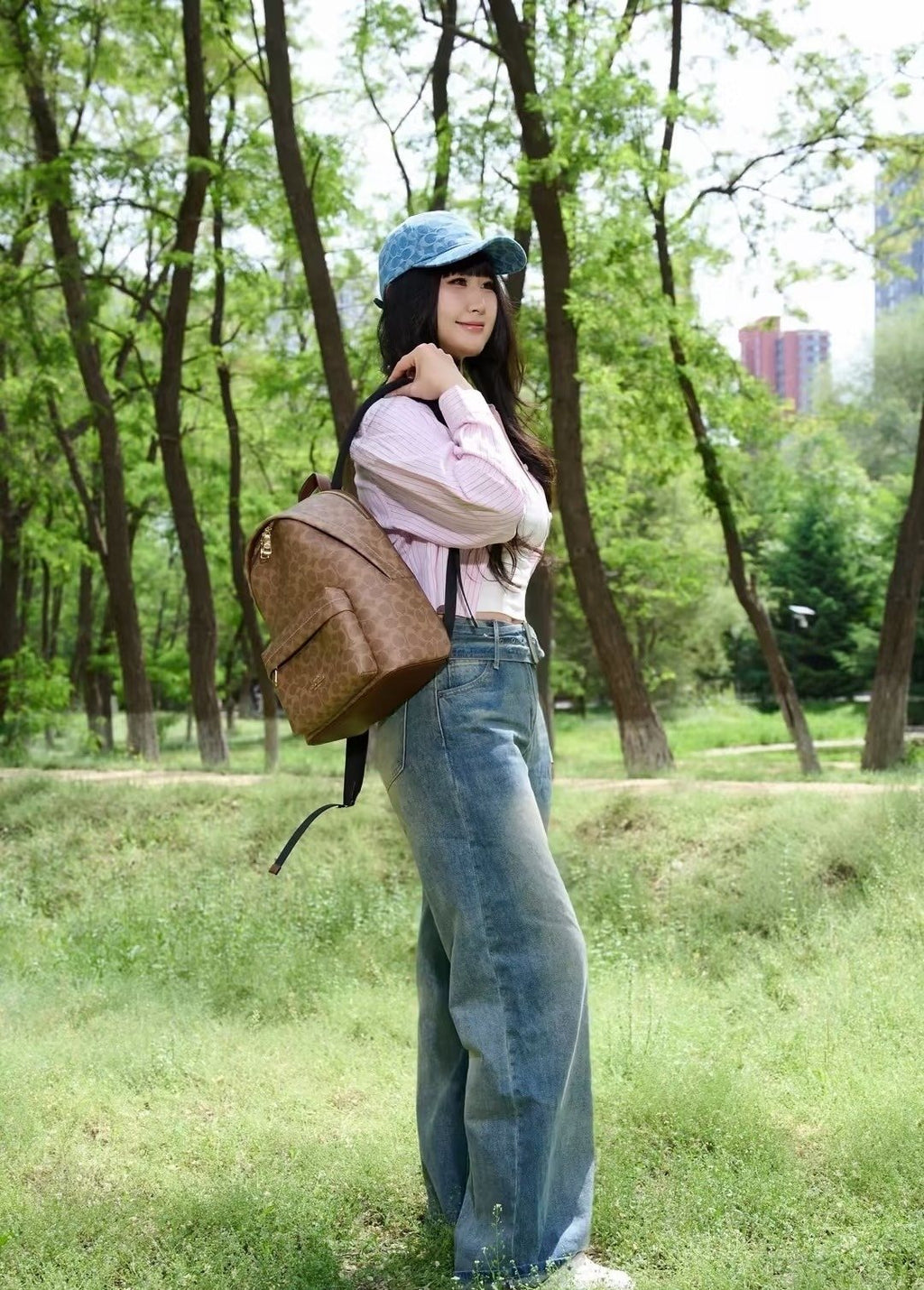 Coach Taylor Monogram Zip-Pocket Backpack — model