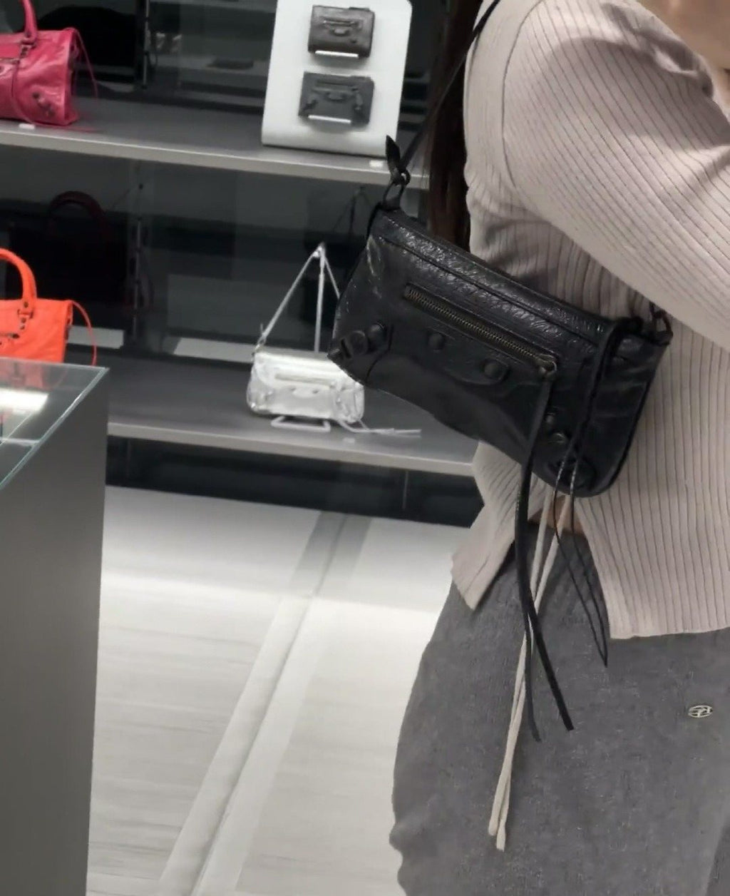 Balenciaga Studded Shoulder Bag with Long Zipper Ties — model