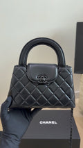 Chanel Kelly Quilted Top-Handle Bag — hero